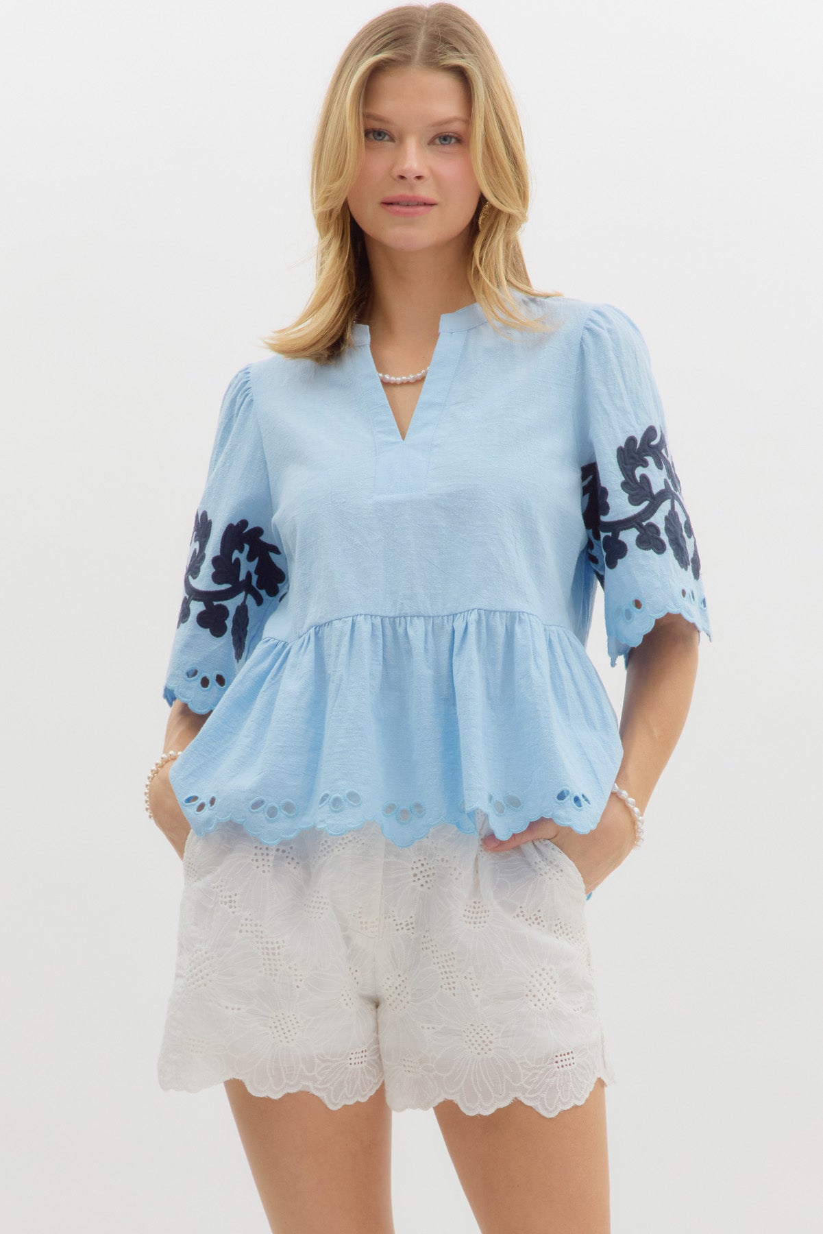 LIGHT BLUE PEPLUM WITH NAVY FLORAL DETAILS